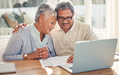 retired couple on computer